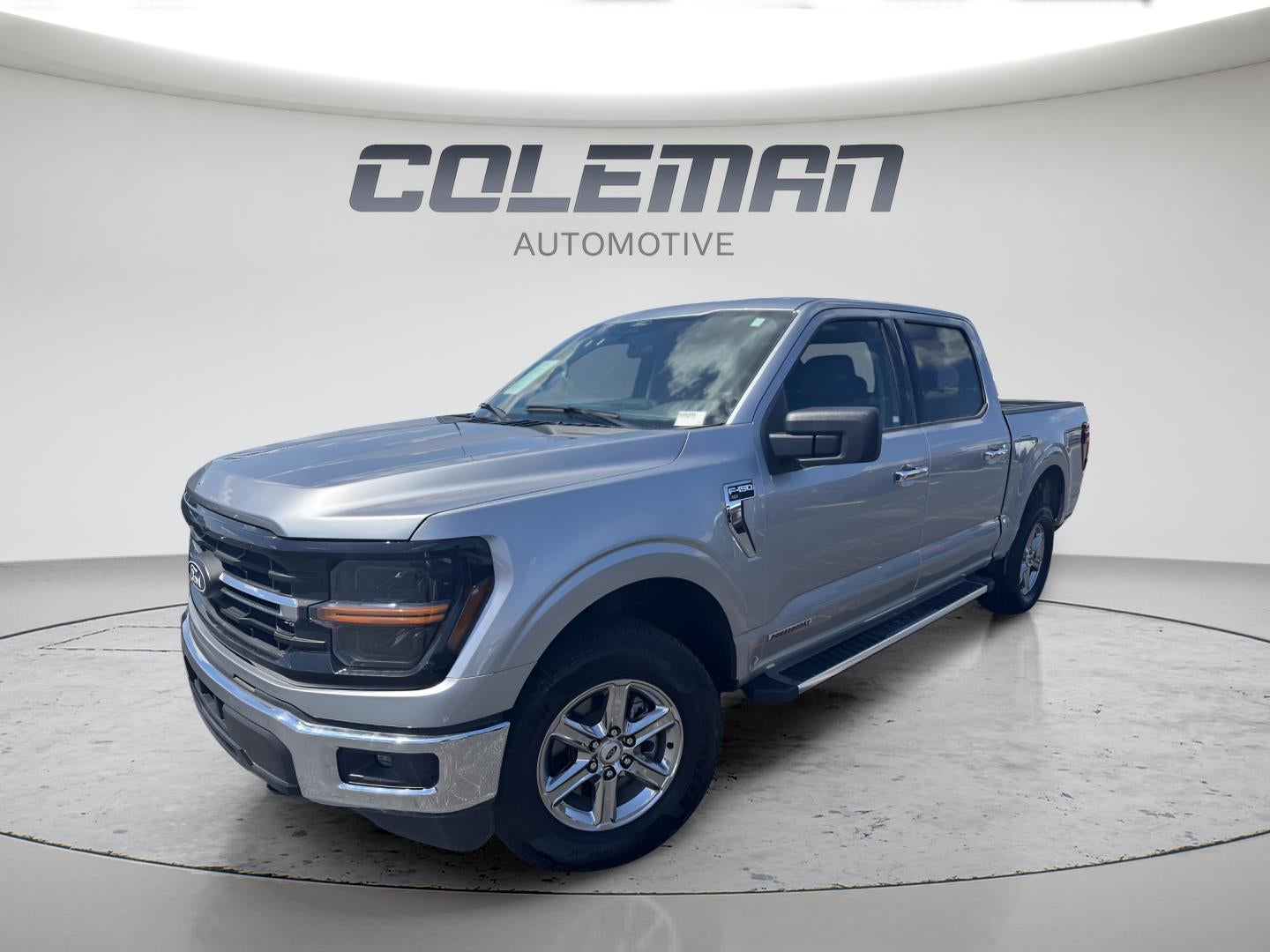 2025 Ford F-150 XLT in Iconic Silver — front three-quarter view