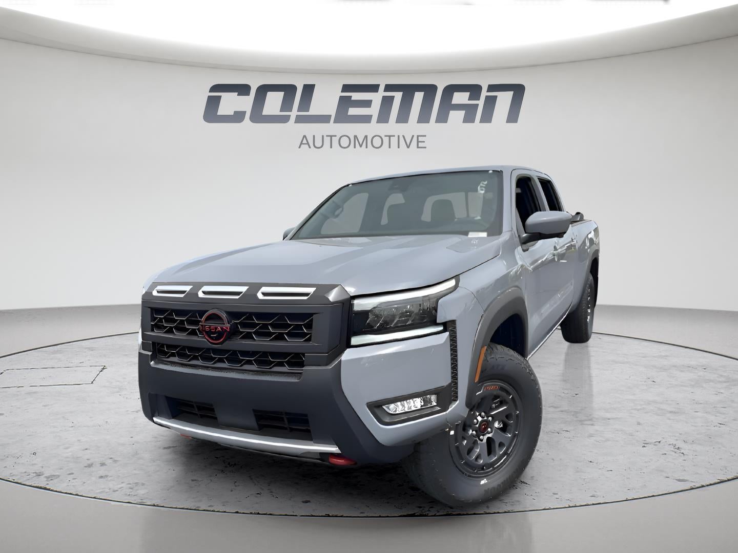 2026 Nissan Frontier Crew Cab PRO-X in Boulder Gray Pearl — front three-quarter view