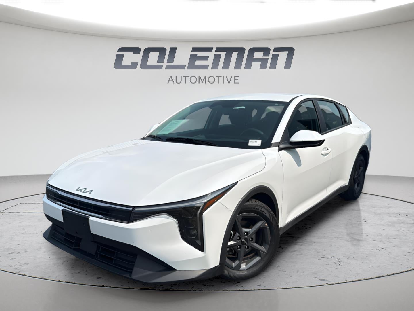 2025 Kia K4 LXS in Snow White Pearl — front three-quarter view