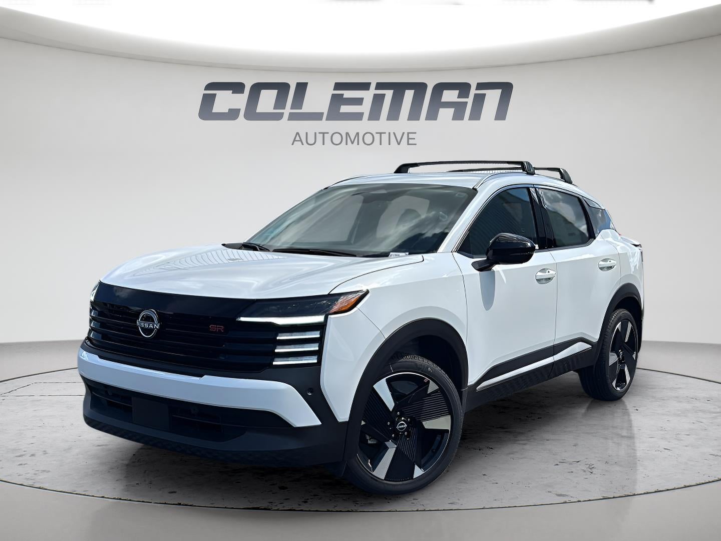 2026 Nissan Kicks SR in Aspen White Tricoat — front three-quarter view
