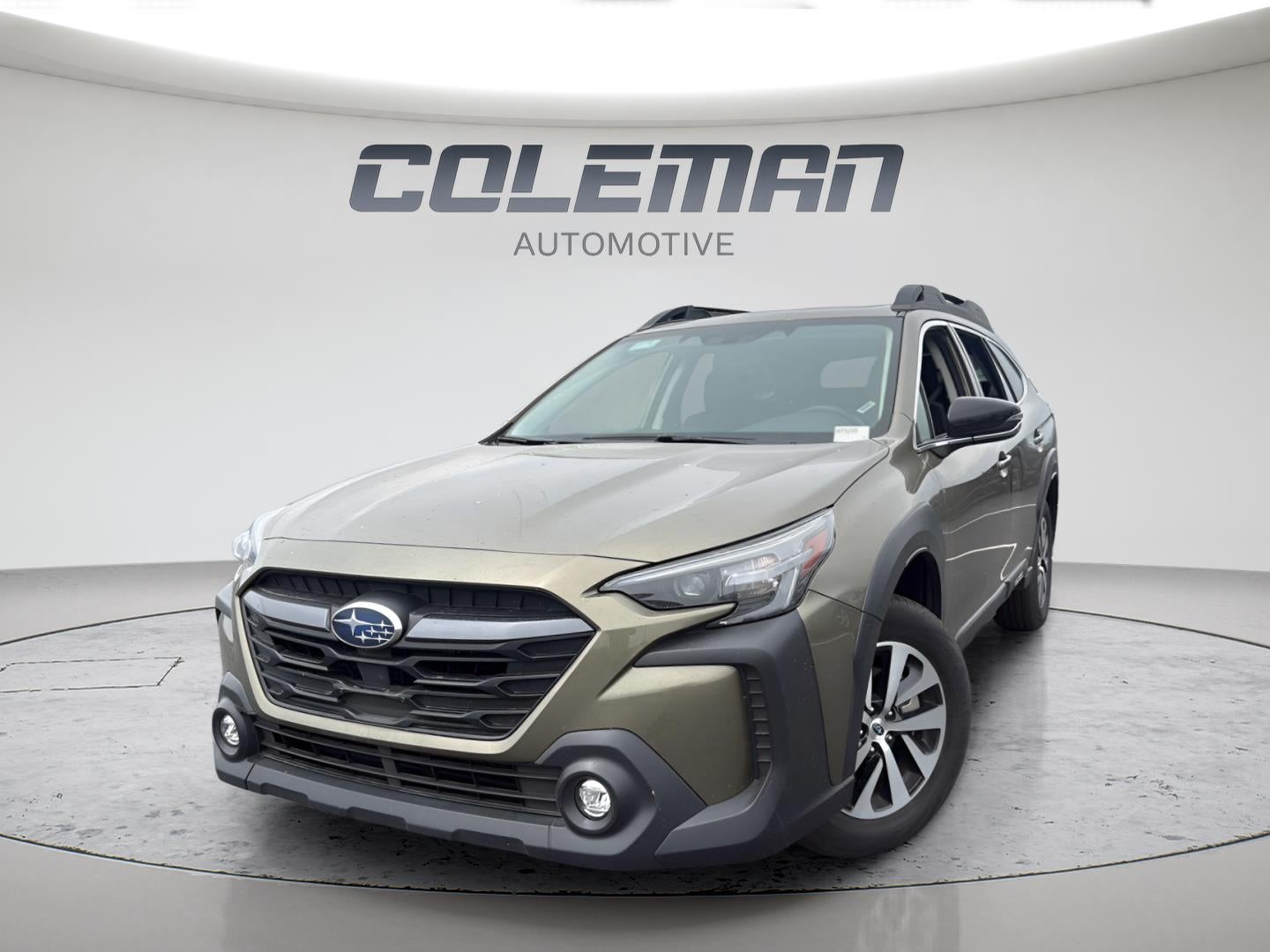 2025 Subaru Outback Premium in Autumn Green Metallic — front three-quarter view