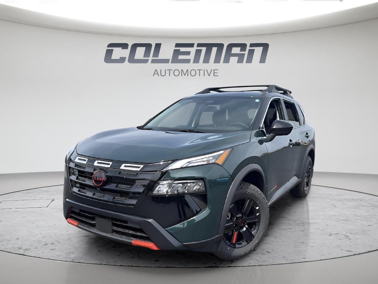 2026 Nissan Rogue Rock Creek in Obsidian Green — front three-quarter view