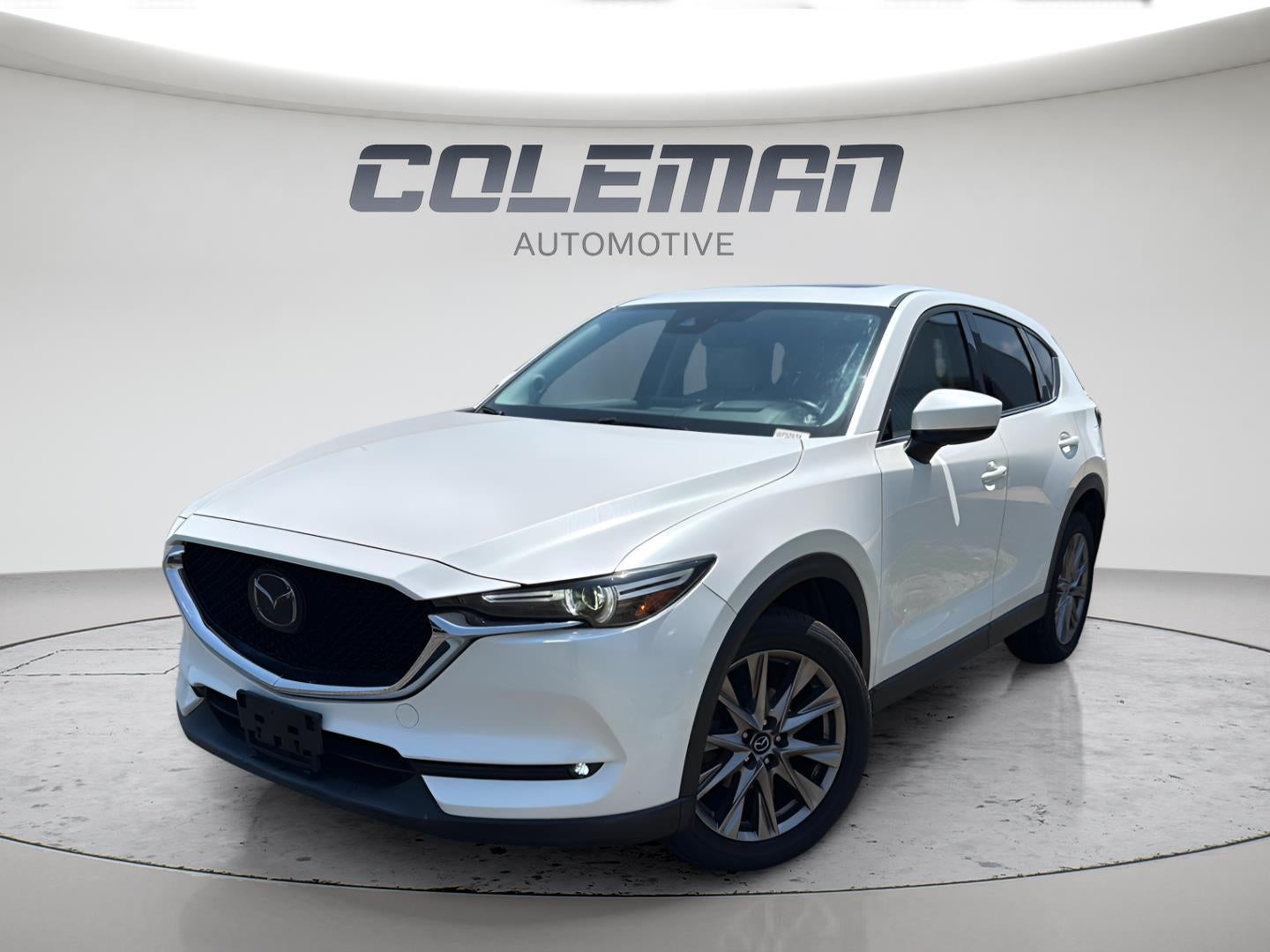 2019 Mazda Mazda CX-5 Grand Touring in Snowflake White Pearl Mica — front three-quarter view