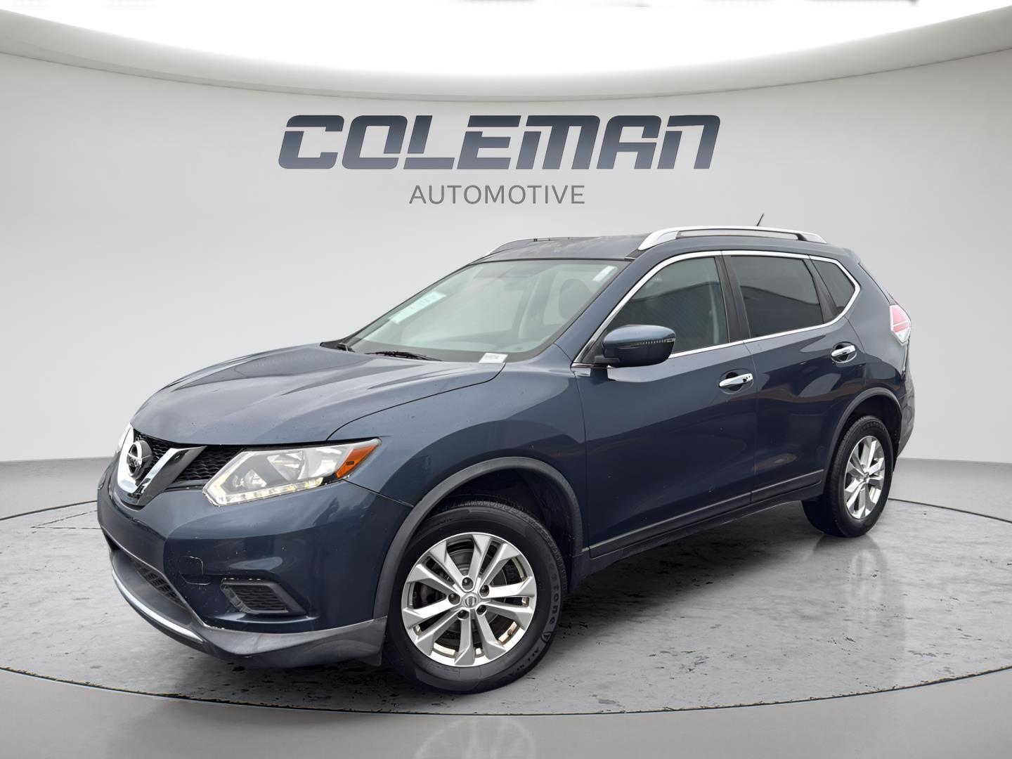 2016 Nissan Rogue SV in Arctic Blue Metallic — front three-quarter view